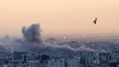 A plume of smoke rises after a strike on Tehran, Iran, on March 3, 2026.
