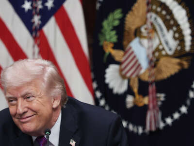 U.S. President Donald Trump listens to speakers during a roundtable meeting on the administration's "ratepayer protection pledge" in the Indian Treaty Room at the White House on March 4, 2026, in Washington, D.C.