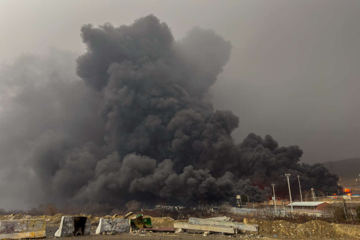 Smoke and flames rise at the site of airstrikes on an oil depot in Tehran, Iran, on March 8, 2026.