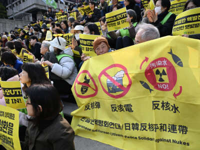 Protesters hold a banner against nukes during an anti-nuclear rally to mark the 15th anniversary of Japan's Fukushima nuclear disaster in Seoul, South Korea, on March 11, 2026.