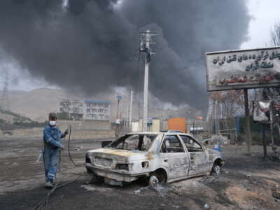 Plumes of smoke rise over the oil depot tanks hit by joint Israel-U.S. strikes over night in a station north west of the capital on March 8, 2026, in Tehran, Iran.