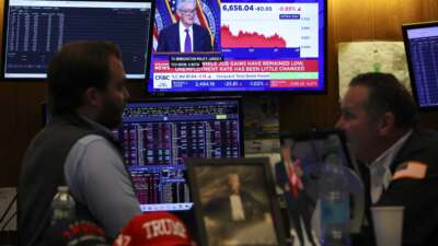 A livestream shows Jerome Powell, chairman of the U.S. Federal Reserve, speaking after a Federal Open Market Committee meeting, on the floor of the New York Stock Exchange in New York City on March 18, 2026.