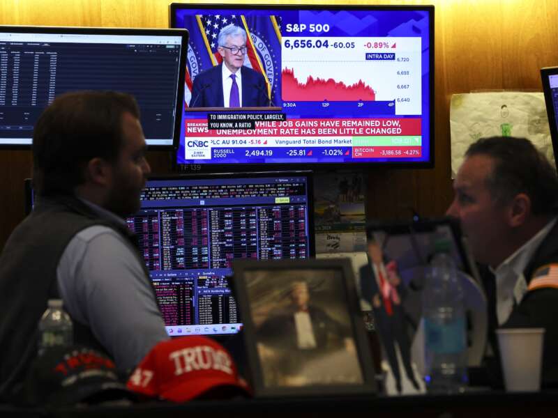 A livestream shows Jerome Powell, chairman of the U.S. Federal Reserve, speaking after a Federal Open Market Committee meeting, on the floor of the New York Stock Exchange in New York City on March 18, 2026.