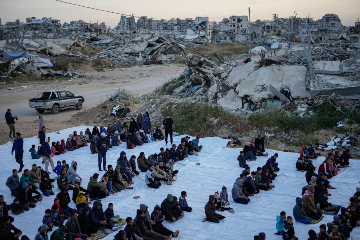 People attend morning prayers during Eid al-Fitr on March 20, 2026, in the Tel al-Hawa area of Gaza City, Gaza.
