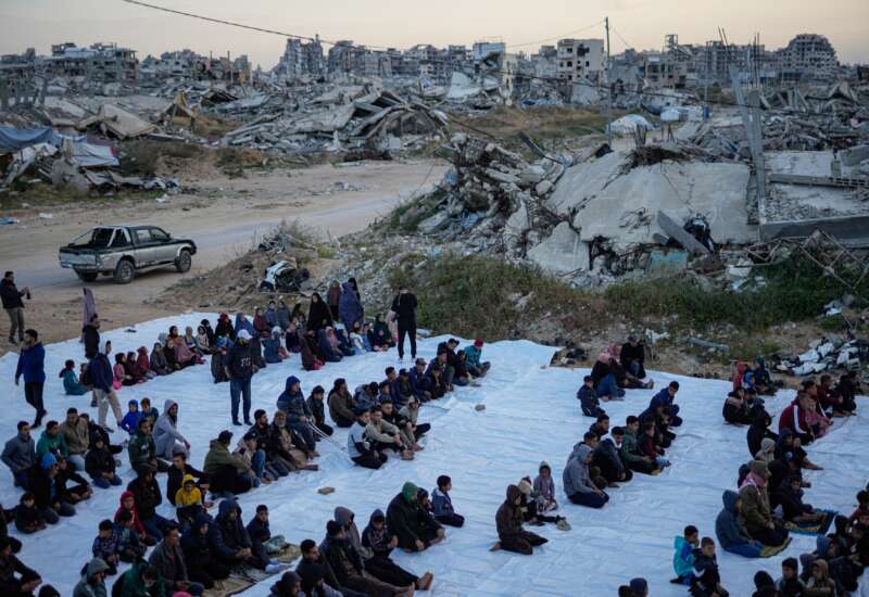 People attend morning prayers during Eid al-Fitr on March 20, 2026, in the Tel al-Hawa area of Gaza City, Gaza.
