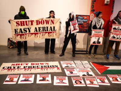 Protesters with Demilitarize Brooklyn Navy Yard occupy Building 77 at the Brooklyn Navy Yard during the February 11 BNYDC Board meeting.