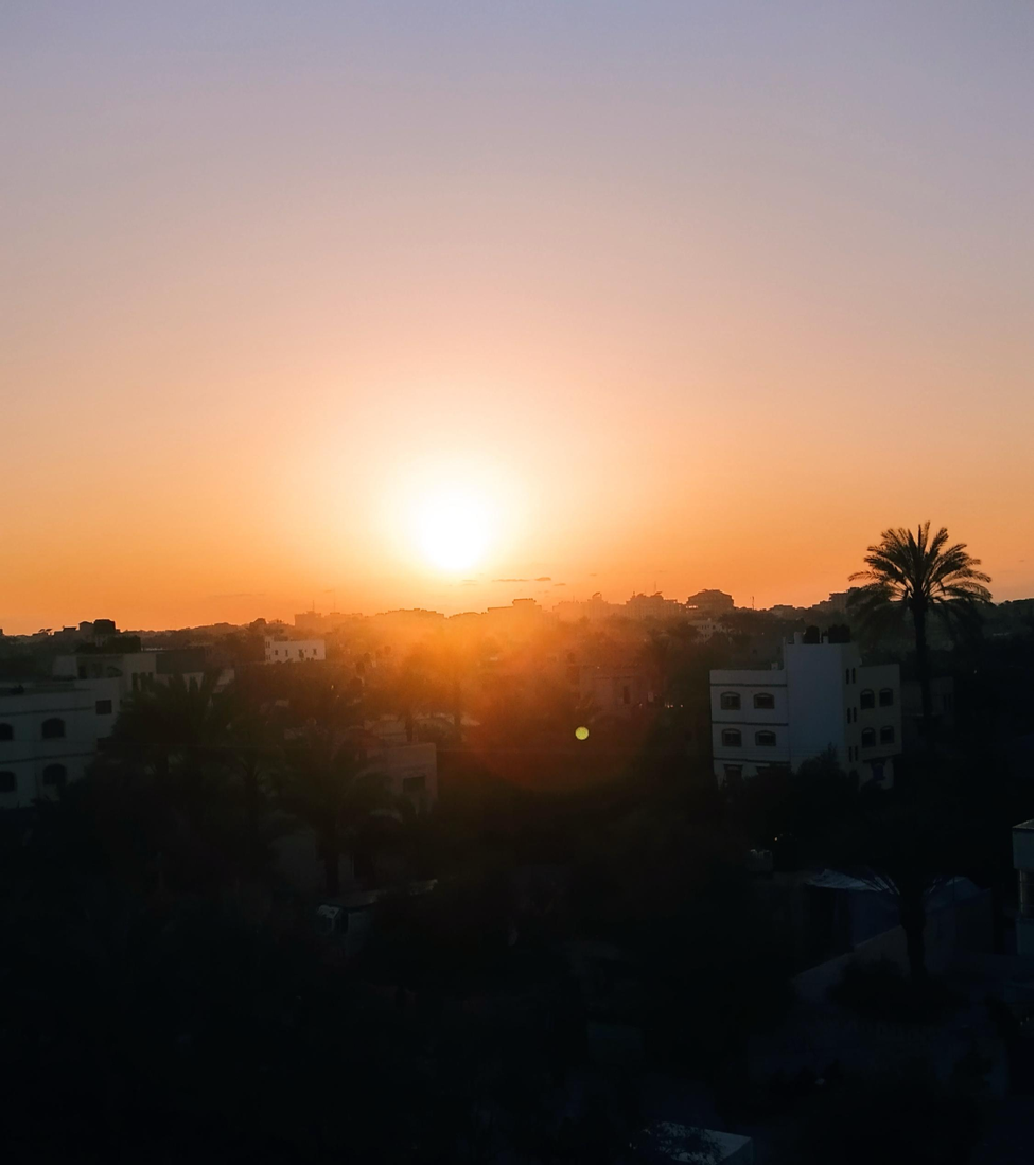 View of the sunset from my grandmother’s window that we saw together as we waited for the Maghrib prayer to break our fast and start iftar together.
