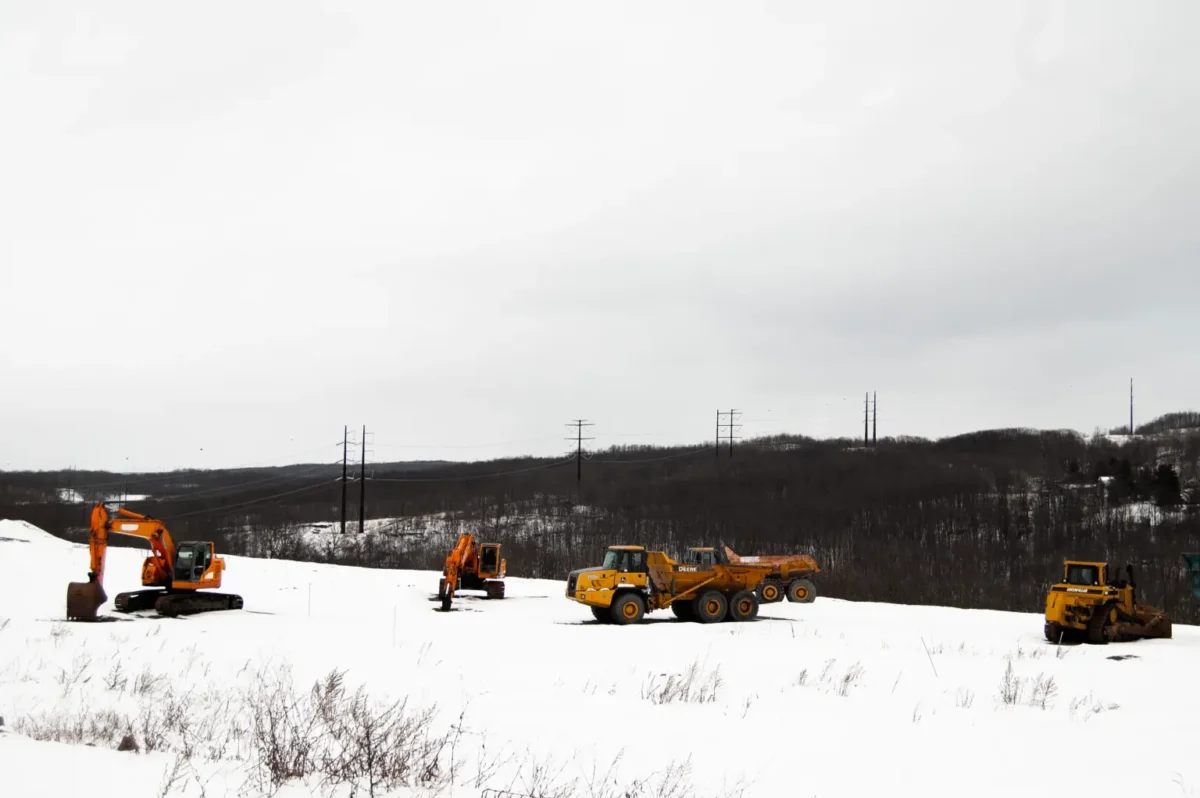 A high-voltage powerline runs behind a construction site in Archbald, Pennsylvania