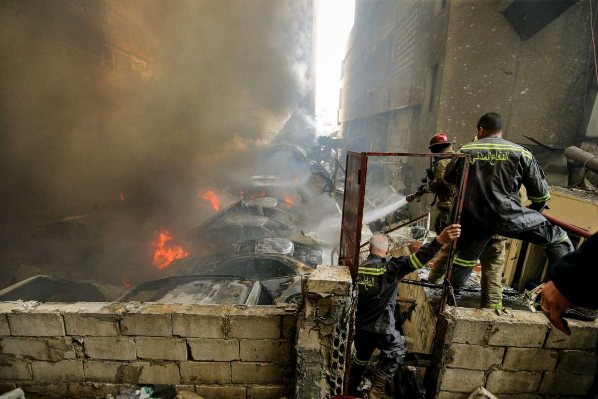 Firefighters try to douse a fire at the site hit by an Israeli airstrike in Beirut on April 8, 2026.