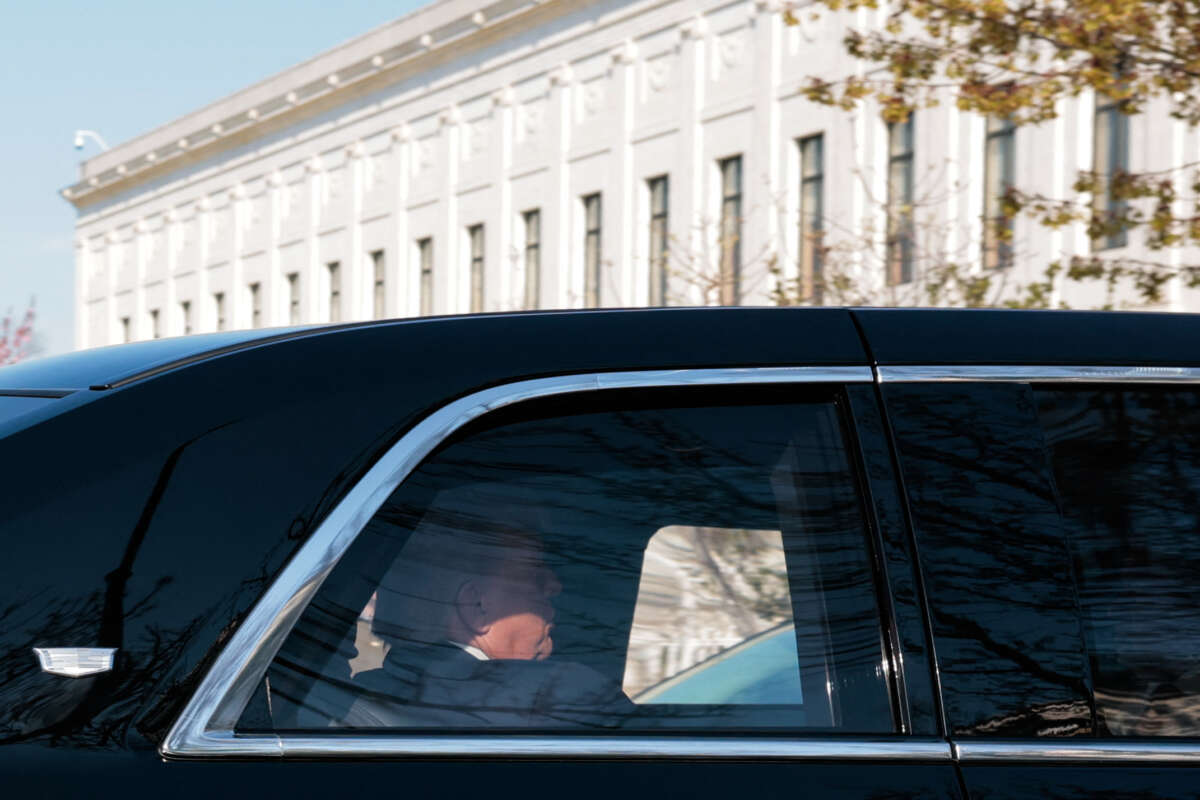 U.S. President Donald Trump rides in his motorcade as he arrives at the US Supreme Court in Washington, D.C. on April 1, 2026.