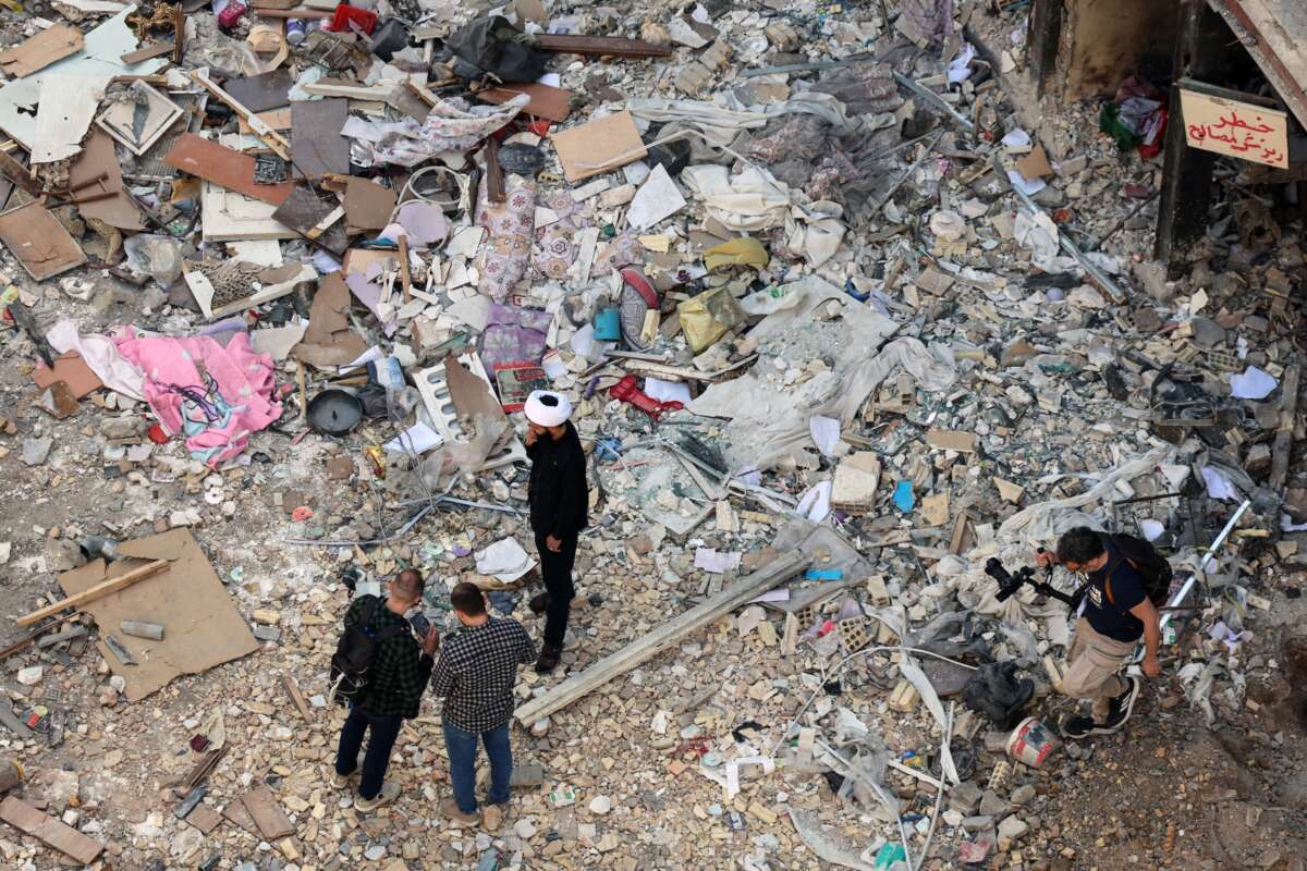 An Iranian cleric speaks to the media in front of a residential building hit by US-Israel airstrikes days before a two-week ceasefire between Iran and the United States took effect, at the Shahid Broujerdi residential complex in southern Tehran on April 14, 2026.