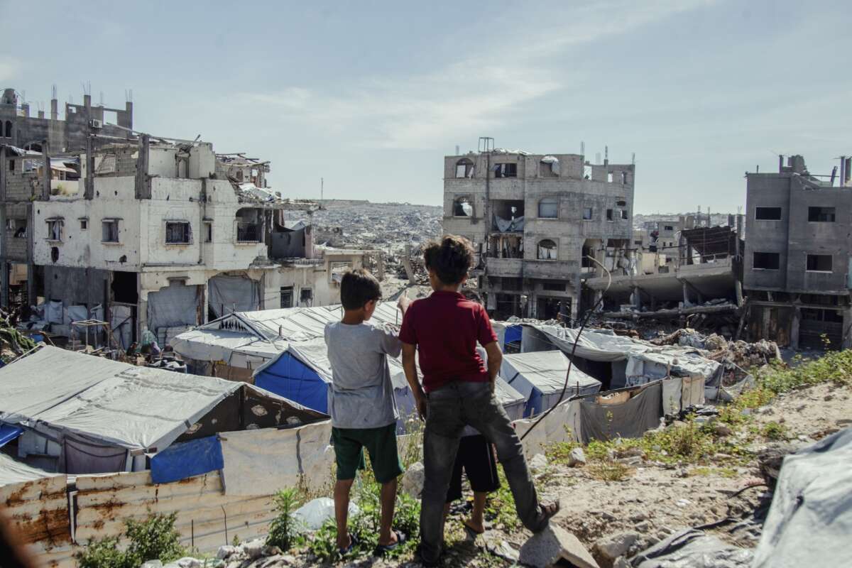 Children stand in the midst of destruction in Jabalia camp in northern Gaza on April 24, 2026. Residents continued to live in the area near the Israeli military’s “yellow line” amid ongoing operations and widespread damage.