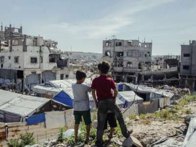 Children stand in the midst of destruction in Jabalia camp in northern Gaza on April 24, 2026. Residents continued to live in the area near the Israeli military’s “yellow line” amid ongoing operations and widespread damage.