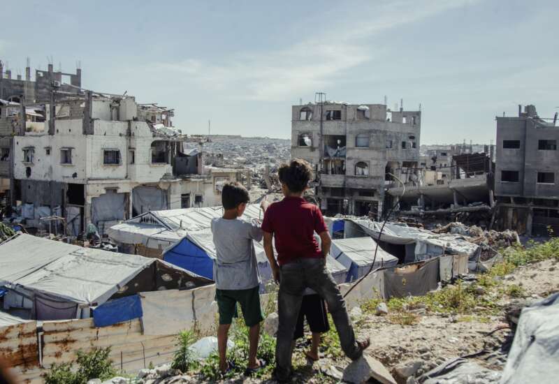 Children stand in the midst of destruction in Jabalia camp in northern Gaza on April 24, 2026. Residents continued to live in the area near the Israeli military’s “yellow line” amid ongoing operations and widespread damage.