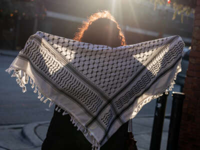 25-year-old Celine Khalife, one of many who lost their jobs after being targeted by a StopAntisemitism doxxing campaign, is photographed holding a Palestinian keffiyeh, on January 11, 2024, in Chicago, Illinois.
