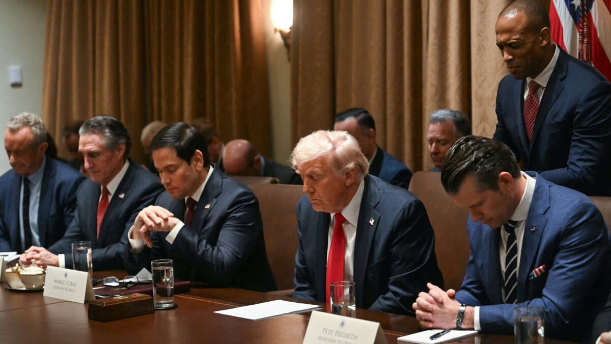 U.S. President Donald Trump bows his head in prayer during a cabinet meeting at the White House in Washington, D.C., on February 26, 2025. Also pictured, L-R, Secretary of Health and Human Services nominee Robert F. Kennedy Jr., Secretary of the Interior Doug Burgum, Secretary of State Marco Rubio, Secretary of Defense Pete Hegseth, and Housing and Urban Development Secretary Scott Turner.