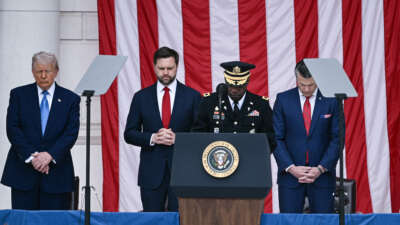 President Donald Trump, Vice President JD Vance, and Secretary of Defense Pete Hegseth bow their heads during the invocation the amphitheatre at the Tomb of the Unknown Soldier in Arlington National Cemetery in Arlington, Virginia, on Memorial Day, May 26, 2025.