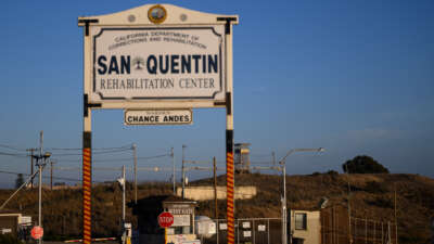 Signage stands at the west gate entrance to the San Quentin Rehabilitation Center in San Quentin, California, on October 21, 2025.
