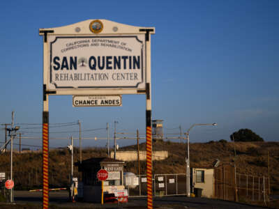 Signage stands at the west gate entrance to the San Quentin Rehabilitation Center in San Quentin, California, on October 21, 2025.