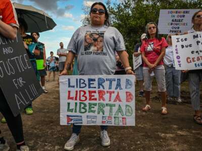 Demonstrators protest against Immigration and Customs Enforcement (ICE) and demanding the closure of the immigrant detention center known as "Alligator Alcatraz" outside the center at the Dade-Collier Training and Transition Airport in Ochopee, Florida, on January 11, 2026.