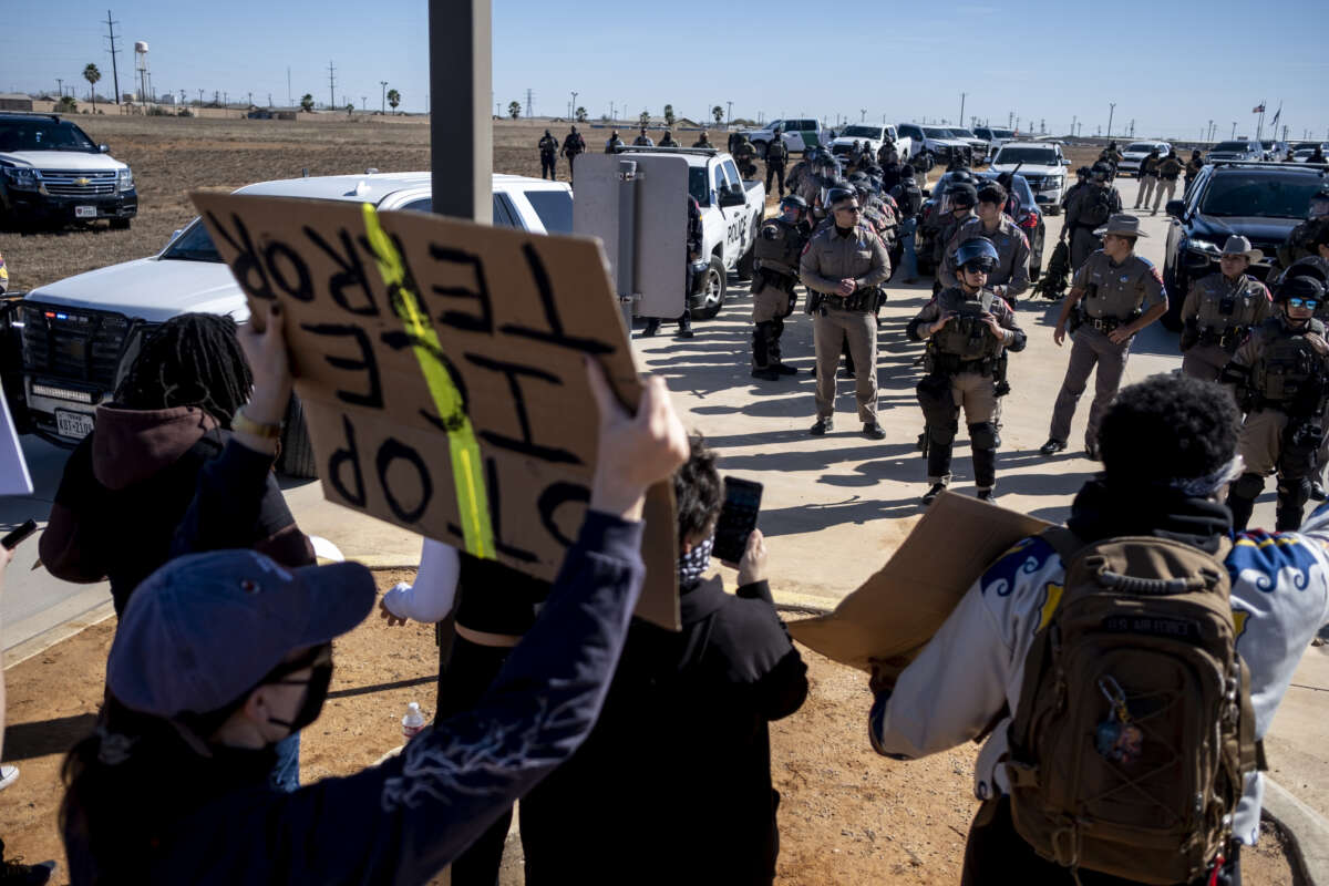Texas State Troopers prepare to disperse a crowd protesting Immigration and Customs Enforcement outside the South Texas Family Residential Center on January 28, 2026 in Dilley, Texas.