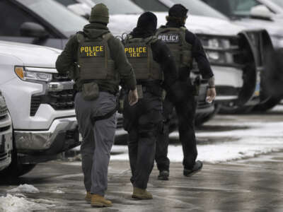 ICE agents depart the Bishop Henry Whipple Federal Building on February 4, 2026, in Minneapolis, Minnesota.