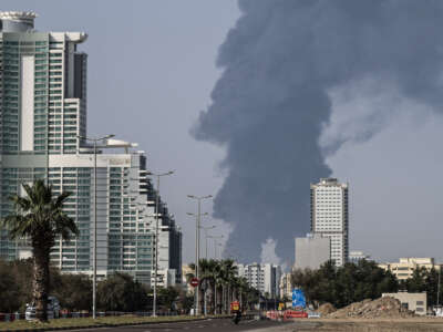 Smoke rises from the direction of an energy installation in Fujairah, United Arab Emirates, on March 14, 2026.