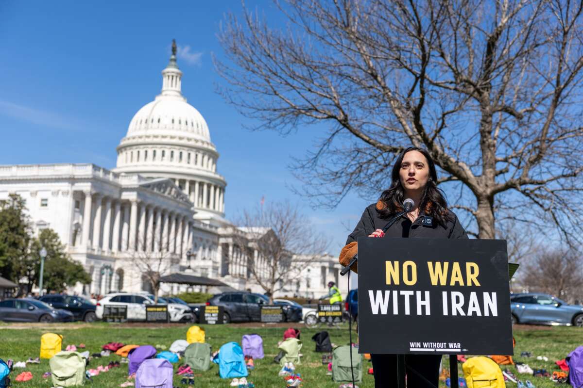 Rep. Yassamin Ansari (D-AZ) speaks on Capitol Grounds in front of a memorial of 168 pairs of shoes representing those killed in the U.S. strike that killed over 150 schoolchildren, on March 18, 2026, in Washington, D.C.