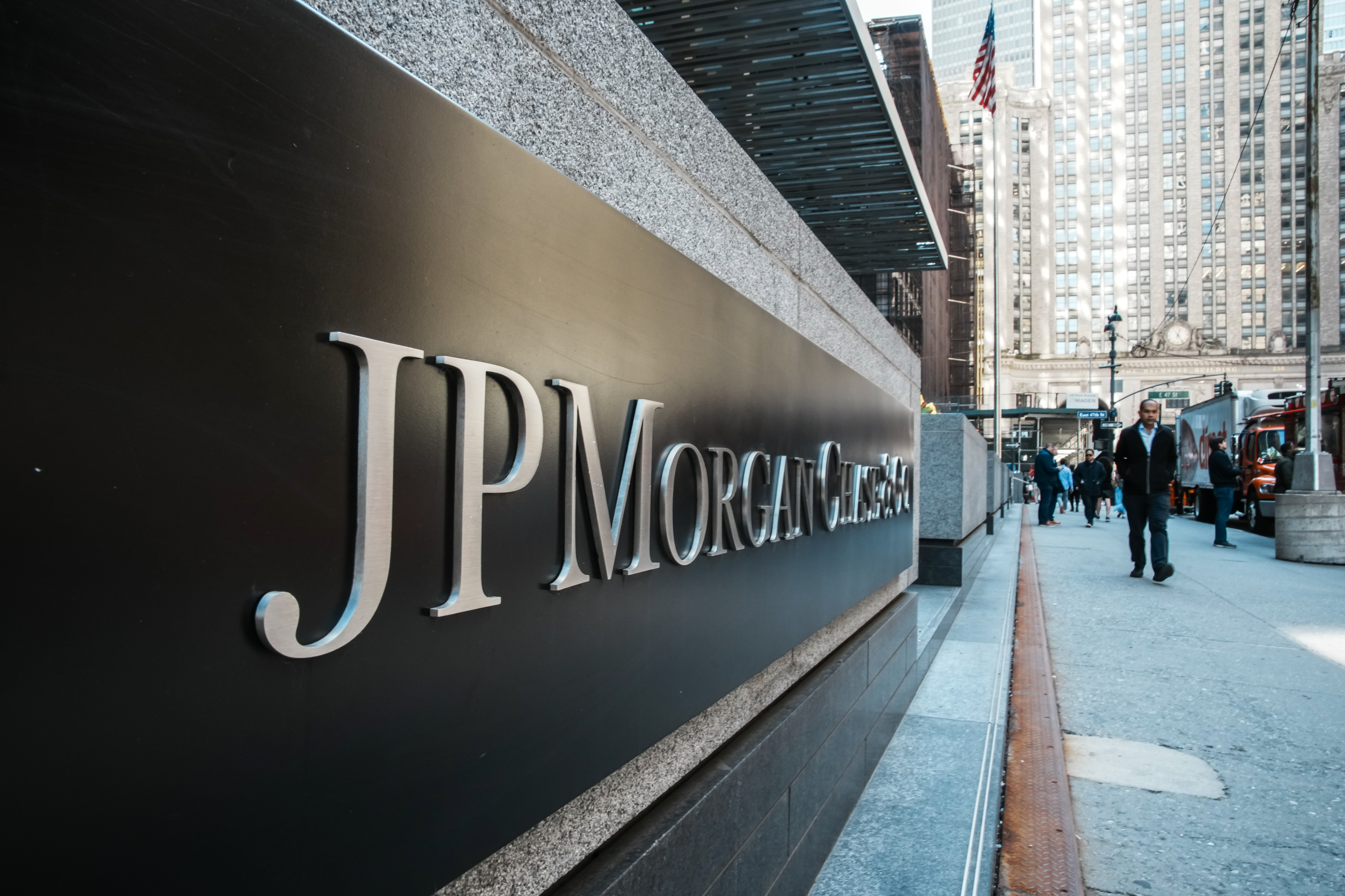 People walk near the JPMorgan Chase headquarters on April 6, 2026, in New York City.