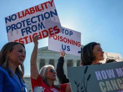 Protesters gather at the Supreme Court, which was set to hear arguments in a case that could lead to the dismissal of tens of thousands of lawsuits against Bayer that claim the weedkiller Roundup, made by Monsanto, caused non-Hodgkin lymphoma, on April 27, 2026, in Washington, D.C.