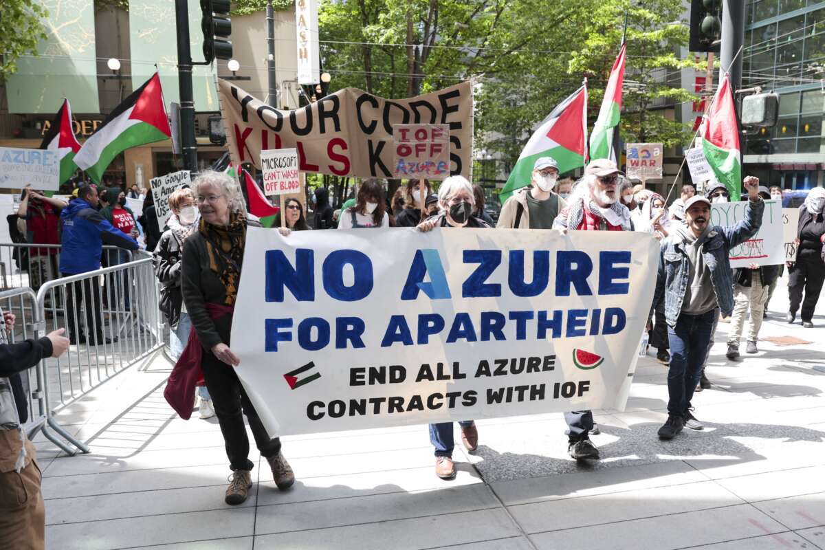 Pro-Palestinian demonstrators hold banners and signs as they protest outside the Microsoft Build conference at the Seattle Convention Center in Seattle, Washington on May 19, 2025.