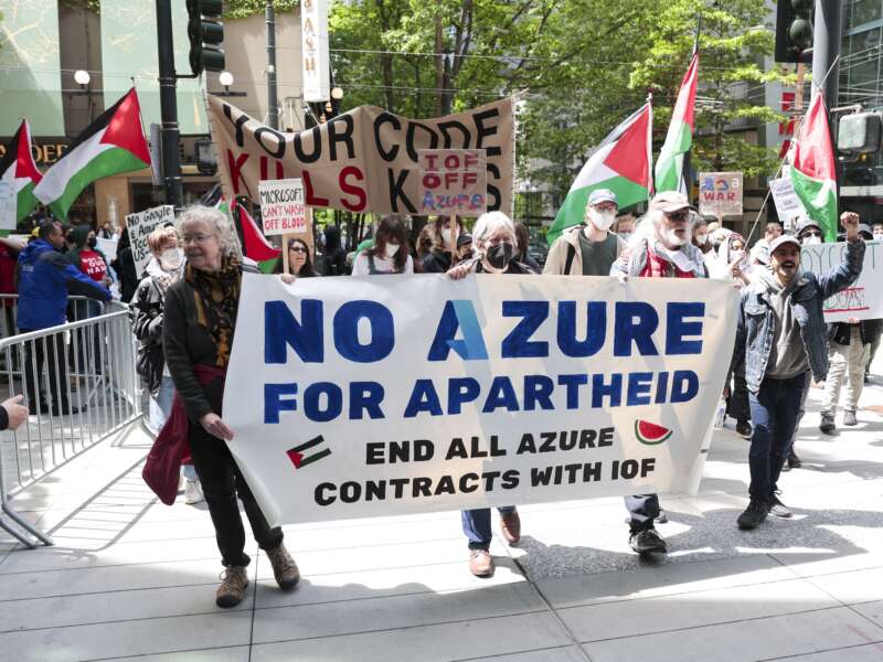 Pro-Palestinian demonstrators hold banners and signs as they protest outside the Microsoft Build conference at the Seattle Convention Center in Seattle, Washington on May 19, 2025.