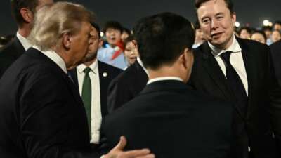 US President Donald Trump presents SpaceX, Twitter and Tesla CEO Elon Musk to China’s Vice President Han Zheng at Beijing Capital Airport on May 13, 2026.