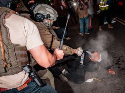 ICE agents spray a protestor with a chemical irritant before detaining them outside of the federal immigration center at Delaney Hall, where ICE is housing detained immigrants, on May 28, 2026 in Newark, New Jersey.