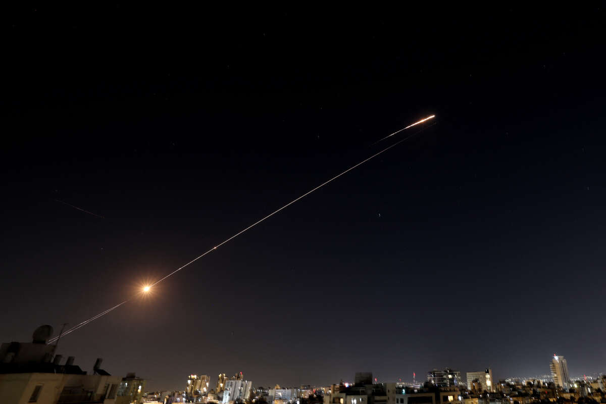 Rocket trails are seen in the sky above the Israeli city of Netanya amid a fresh barrage of Iranian missile attacks on March 11, 2026. The Israeli military said on March 10, it had begun a new wave of strikes on Tehran, on the 11th day of the Middle East war.