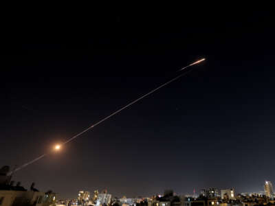 Rocket trails are seen in the sky above the Israeli city of Netanya amid a fresh barrage of Iranian missile attacks on March 11, 2026. The Israeli military said on March 10, it had begun a new wave of strikes on Tehran, on the 11th day of the Middle East war.