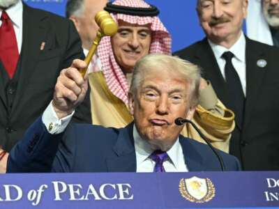 US President Donald Trump holds a gavel during a signing ceremony at the inaugural meeting of the "Board of Peace" in Washington, DC, on February 19, 2026.