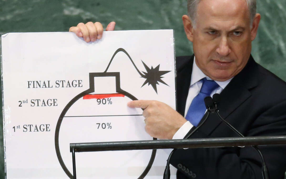 Israeli Prime Minister Benjamin Netanyahu points to a red line he drew on a graphic of a bomb while addressing the United Nations General Assembly on September 27, 2012, in New York City.