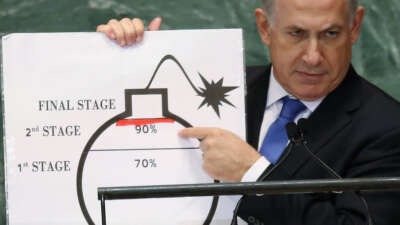 Israeli Prime Minister Benjamin Netanyahu points to a red line he drew on a graphic of a bomb while addressing the United Nations General Assembly on September 27, 2012, in New York City.