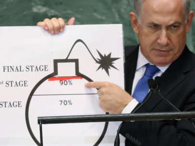 Israeli Prime Minister Benjamin Netanyahu points to a red line he drew on a graphic of a bomb while addressing the United Nations General Assembly on September 27, 2012, in New York City.