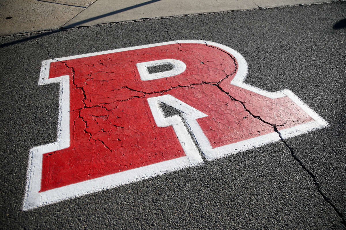 The Rutgers Scarlet Knights logo is shown on concrete before the game between the Rutgers Scarlet Knights and the Oregon Ducks at SHI Stadium on October 18, 2025, in Piscataway, New Jersey.