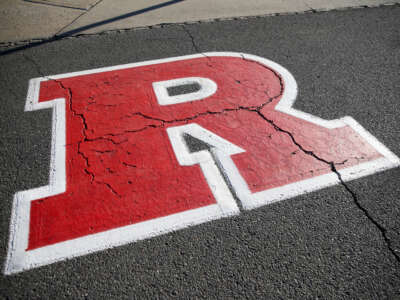 The Rutgers Scarlet Knights logo is shown on concrete before the game between the Rutgers Scarlet Knights and the Oregon Ducks at SHI Stadium on October 18, 2025, in Piscataway, New Jersey.