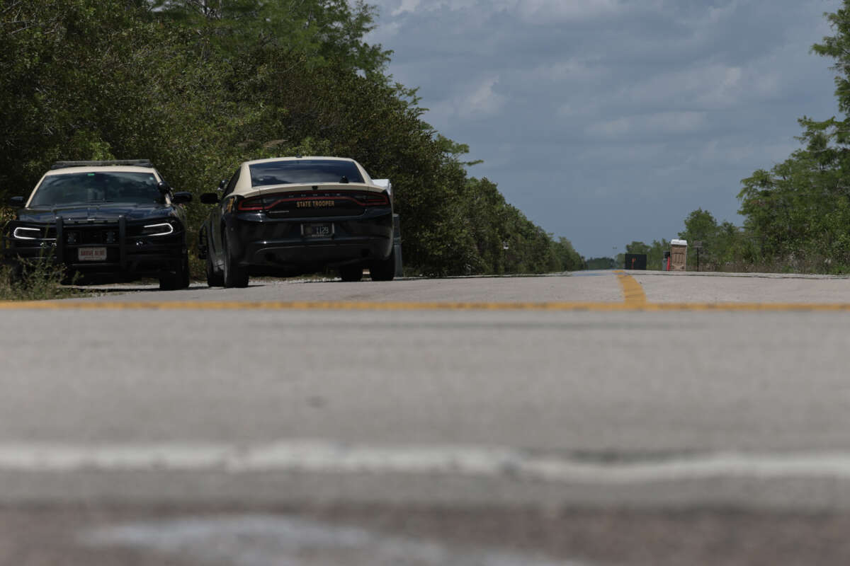 Florida Highway Patrol vehicles are seen at the front entrance to the immigration detention center in the Florida Everglades known as “Alligator Alcatraz” on April 22, 2026, in Miami, Florida.