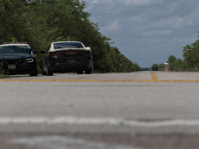 Florida Highway Patrol vehicles are seen at the front entrance to the immigration detention center in the Florida Everglades known as “Alligator Alcatraz” on April 22, 2026, in Miami, Florida.
