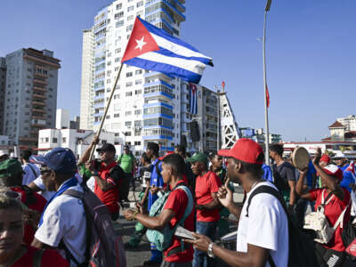 People march along Havana's waterfront to mark International Workers' Day at the Anti-Imperialist Platform in front of the U.S. Embassy in Havana, Cuba, on May 1, 2026.