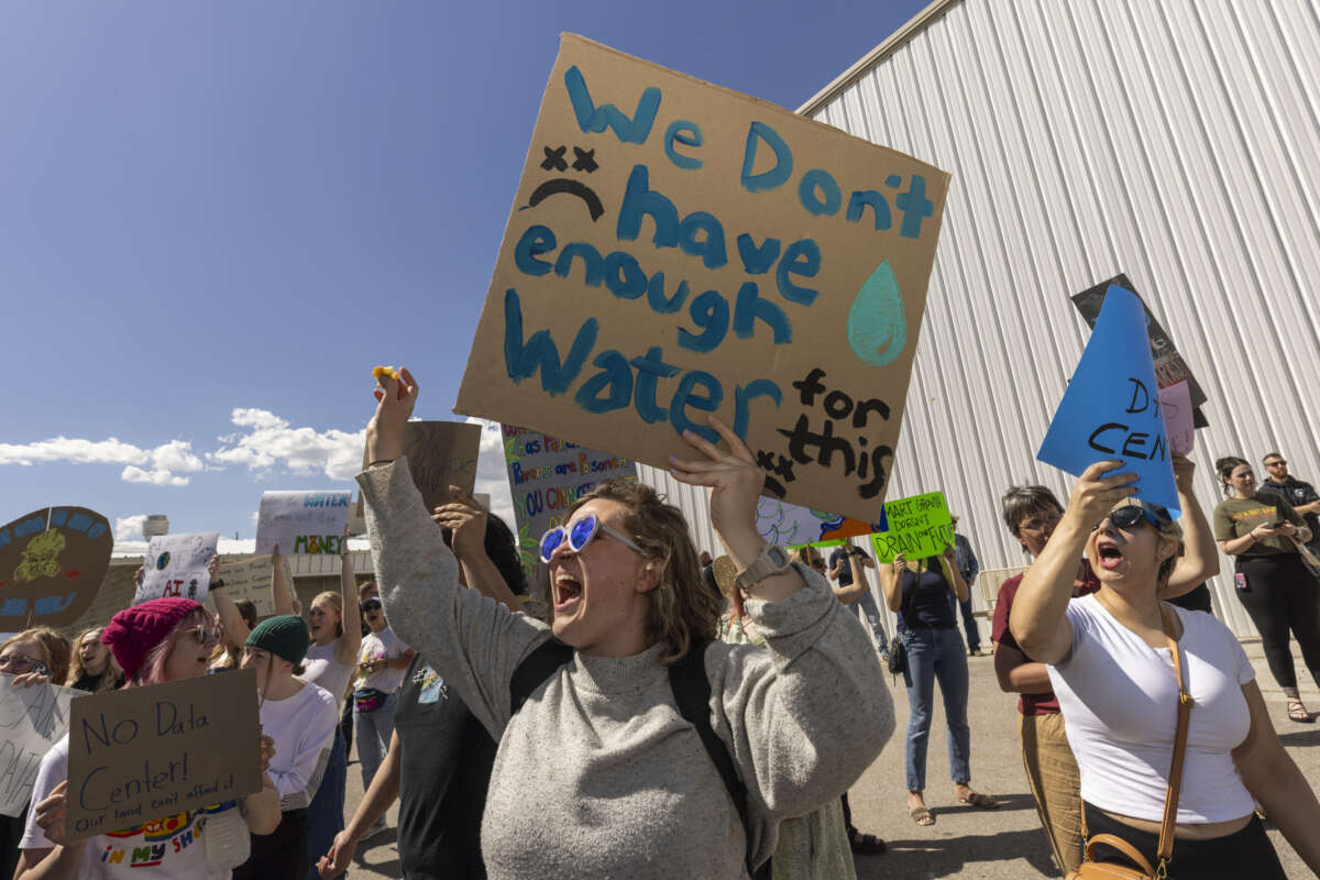 Protesters gather ahead of a Box Elder County County Commission meeting to decide whether to approve the construction of a large data center on May 4, 2026, in Tremonton, Utah.