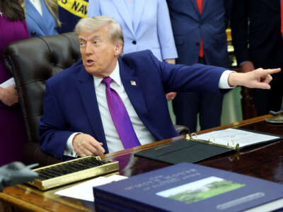 President Donald Trump points out a member of the press during an event on maternal healthcare in the Oval Office of the White House on May 11, 2026, in Washington, D.C.