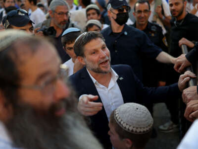 Israel's Finance Minister Bezalel Smotrich takes part in the Jerusalem Day parade at the Damascus Gate in the old city of Jerusalem on May 14, 2026.