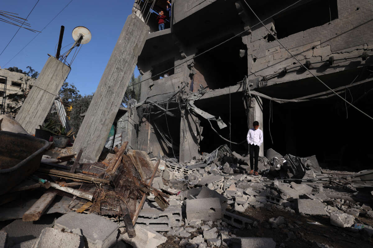 A displaced Palestinian stands on the rubble the day after a house was targeted in an Israeli strike in the Bureij refugee camp in the central of Gaza Strip, on May 20, 2026.