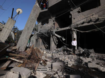 A displaced Palestinian stands on the rubble the day after a house was targeted in an Israeli strike in the Bureij refugee camp in the central of Gaza Strip, on May 20, 2026.